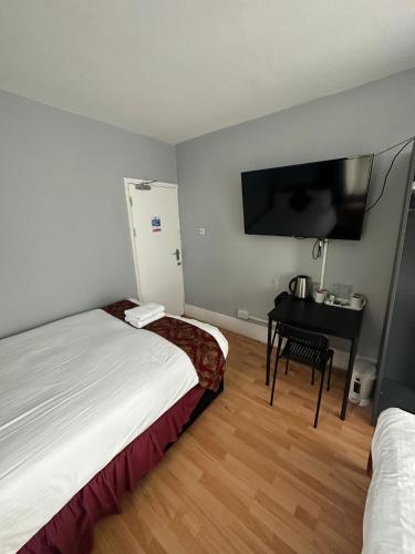 Ένα ή περισσότερα κρεβάτια σε δωμάτιο στο Ruxley Rooms