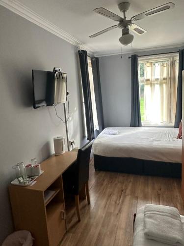 Ένα ή περισσότερα κρεβάτια σε δωμάτιο στο Ruxley Rooms