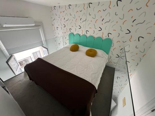 a bedroom with a bed with two teddy bears on it at Viajero Montevideo Hostel in Montevideo