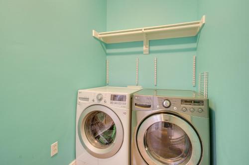 a laundry room with a washer and a dryer at Less Than 1 Mi to Beach - Home with Deck and Yard in Waveland! in Waveland