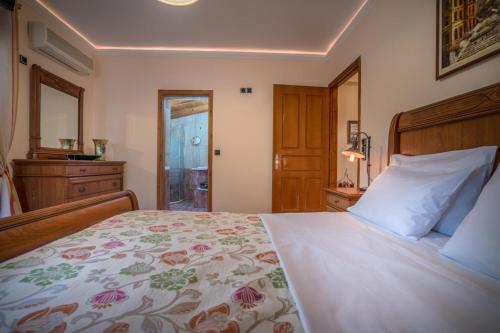 Postel nebo postele na pokoji v ubytování Eleonas Private pool villa