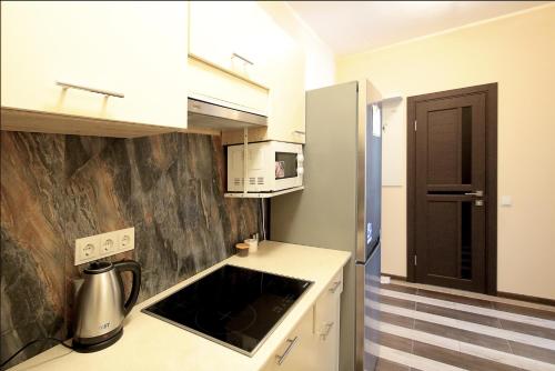 Η κουζίνα ή μικρή κουζίνα στο "Deluxe Apartments" C 16-Є - 1221