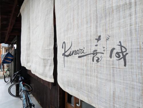 a bike parked next to a building with curtains on it at guesthouseKinari - Vacation STAY 99387v in Otsu