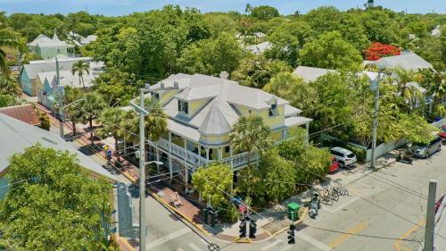an overhead view of a large building with trees at The Pirates Penthouse by Last Key Realty in Key West