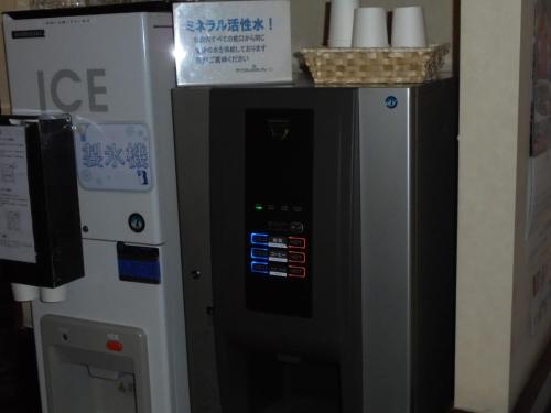 a vending machine with a box on top of it at Terminal Art Inn - Vacation STAY 97332v in Niigata