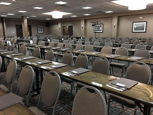 an empty room with rows of tables and chairs at Best Western Plus Kingston Hotel and Conference Center in Kingston