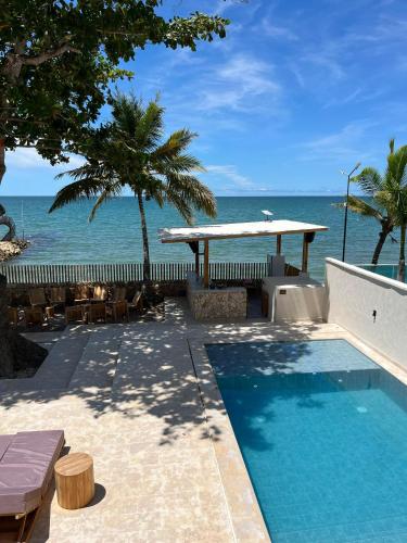 a swimming pool with a view of the ocean at Talam House Coveñas by Bernalo Hotels in Coveñas