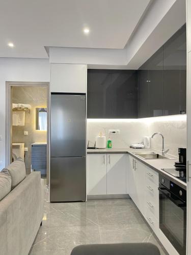 Η κουζίνα ή μικρή κουζίνα στο Cozy Home With Cooking Near Tram