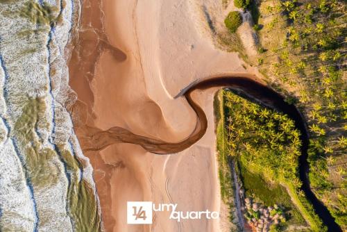 an overhead view of a beach with the ocean at Ponta de Inhambupe Residences in Baixio