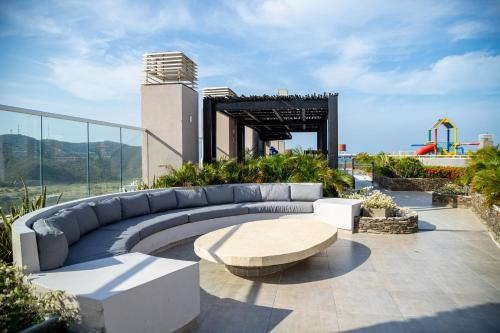 a large couch sitting on top of a building at Apartamentos Luxury Frente al Mar - AR Rentals in Gaira
