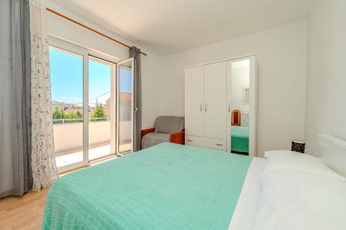 Posteľ alebo postele v izbe v ubytovaní Apartments Mlado