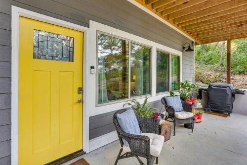 a yellow door on a house with chairs at 6 Mi to Downtown Apartment in Chattanooga! in Chattanooga