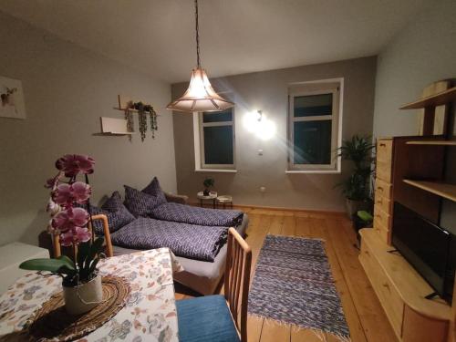 a living room with a couch and a table at Spacious Room in Tyrolean Flat in Innsbruck