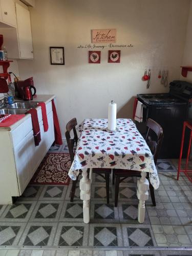 a kitchen with a table with a candle on it at Tower of Little Italy in Niagara Falls