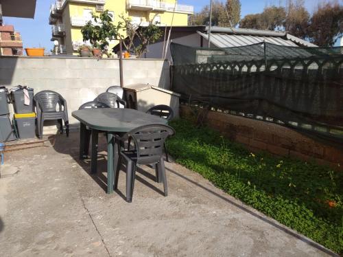 a table and chairs sitting on a patio at La casa di Enrico & Giusy in Passoscuro