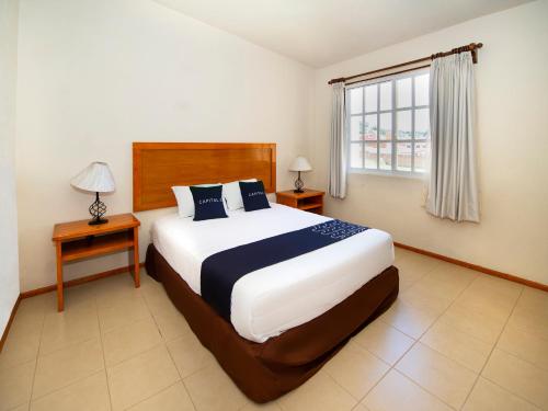 Postel nebo postele na pokoji v ubytování Hotel La Casa de Don Tito, Jocotitlan