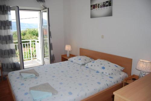 Postel nebo postele na pokoji v ubytování Apartments Krila