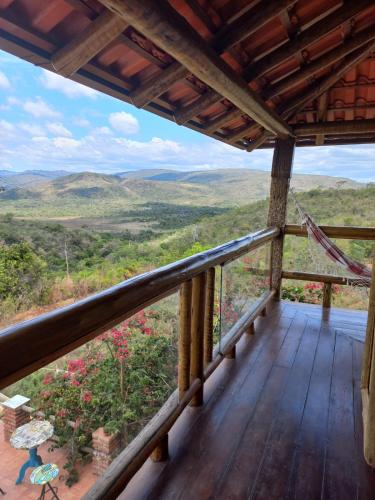 a porch with a view of the mountains at Pousada Cachoeiras do Cipó in Serra do Cipo