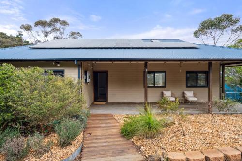 a house with a solarium on the roof at Charming 4 Bed Home in Mount Victoria in Mount Victoria