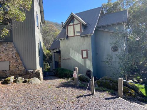 a house with a sign in front of it at Mitta Mitta - Thredbo in Thredbo