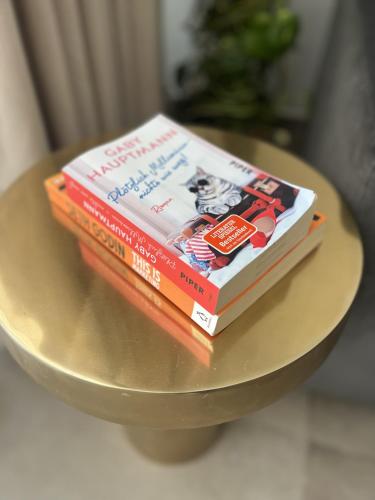 two books sitting on top of a table at Cute little Penthouse in the Heart of Sliema in Sliema