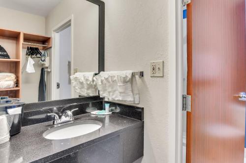 a bathroom with a sink and a mirror at Fairfield Inn & Suites Fredericksburg in Fredericksburg