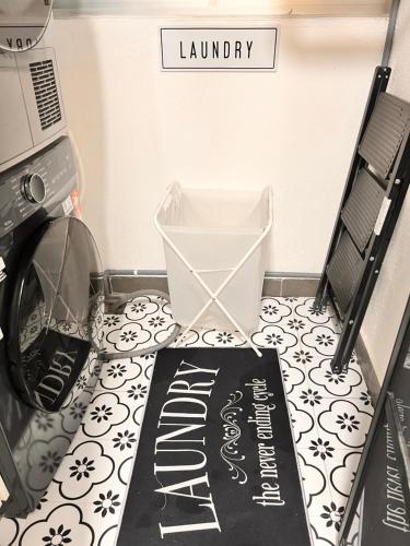 a laundry room with a laundry mat on the floor at Amliza homestay in Cyberjaya
