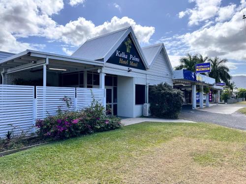 a white building with a sign that reads extra play ball park at Kalka Palms Hotel Motel in Rockhampton