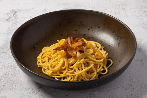 a bowl of pasta with meat and sauce at Chiang Mai Marriott Hotel in Chiang Mai