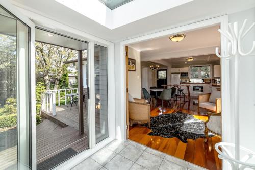 a home with a sliding glass door leading to a porch at Bronte House in Martinborough 