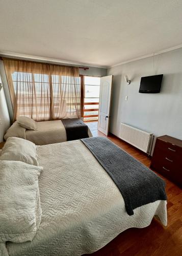 Ein Bett oder Betten in einem Zimmer der Unterkunft Hotel Montecarlo Pichilemu