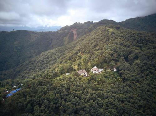 an aerial view of a house on a mountain at Ghost Villa Pokhara with mountain view 20mins from main area in Rānīpauwa