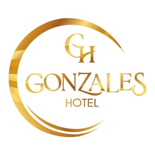 a gold logo with the words gonzalez hotel at Gonzales Hotel in Cauayan