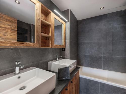 a bathroom with a white sink and a mirror at Appartement à Courchevel 1850, 3 chambres, casier à skis, à 80m des pistes - FR-1-564-96 in Courchevel