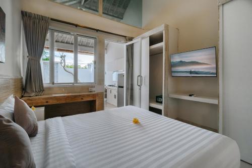 Postel nebo postele na pokoji v ubytování Villa Nakula Suites