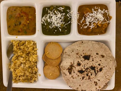 a plastic container filled with different types of food at Blue Eye Hostel in Jaisalmer