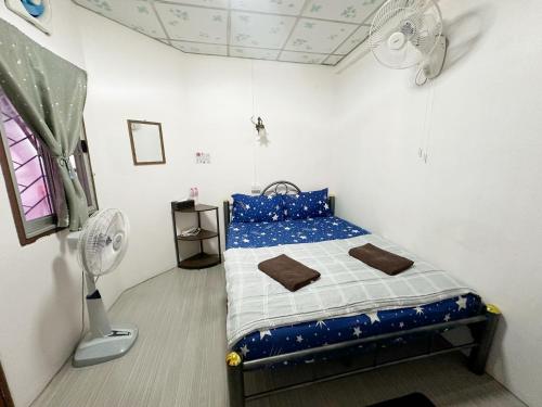 Postel nebo postele na pokoji v ubytování Madam Guesthouse