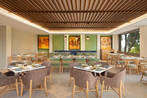 a large dining room with tables and chairs at Fortune Resort & Wellness Spa Bhaktapur, Nepal - Member ITC Hotels' Group in Bhaktapur