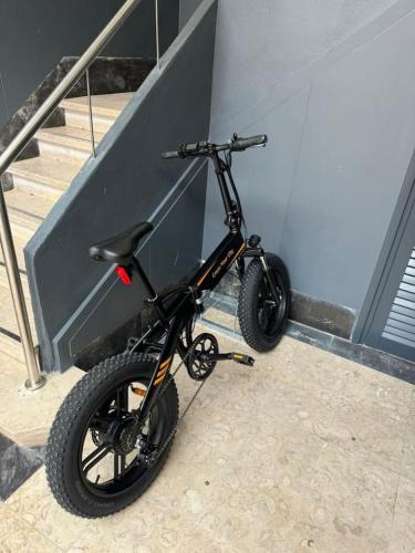 a black scooter parked next to a wall at Lovely studio fully equipped near subway N4 in Lisbon