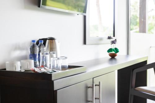 a kitchen counter with a sink in a kitchen at Paddy View Garden Resort in Narammala