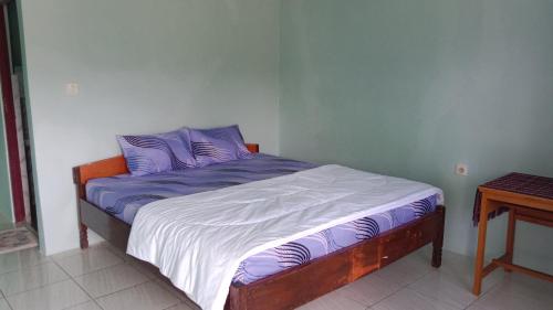 Ένα ή περισσότερα κρεβάτια σε δωμάτιο στο Rice field guest house