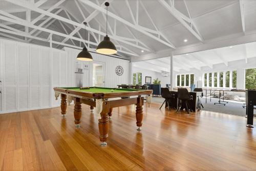 a living room with a pool table in it at Driftwood @ McMillans in Metung