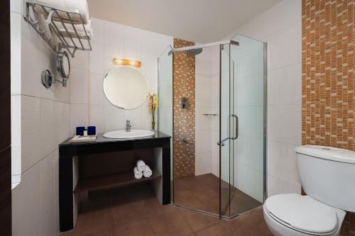 a bathroom with a glass shower and a sink at Fortune Resort & Wellness Spa Bhaktapur, Nepal - Member ITC Hotels' Group in Bhaktapur