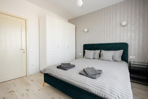 Ένα ή περισσότερα κρεβάτια σε δωμάτιο στο Apartament Darius