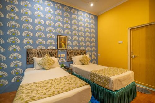 Una cama o camas en una habitación de Tara Guest House