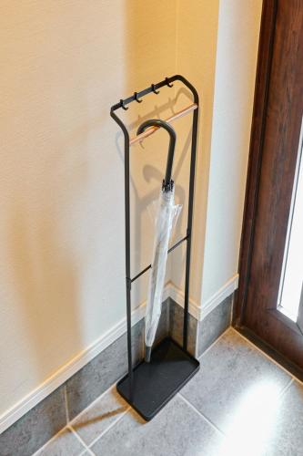 a glass umbrella stand in the corner of a room at VILLA Naebo Sapporo Beer Park Hocance in Sapporo