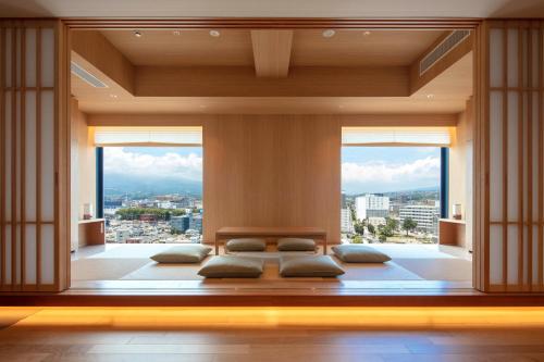 a room with three pillows in a room with windows at Tokyu Vacations Fujisan Mishima in Mishima
