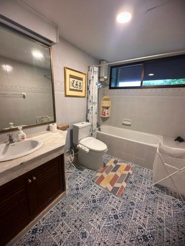 a bathroom with a sink and a toilet and a tub at Newly-renovated Modern Private Thai Villa with Swimming Pool in Ban Khlong Samrong