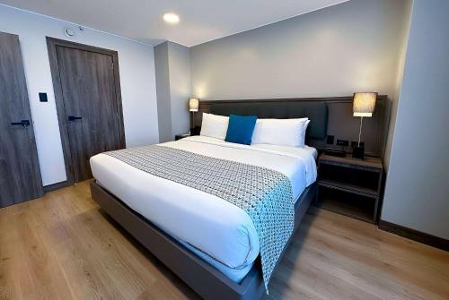 Postel nebo postele na pokoji v ubytování La Quinta by Wyndham Quito