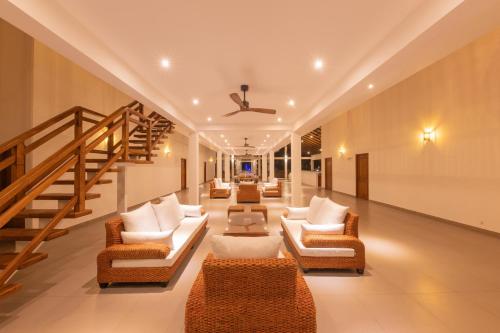 Zona de estar de Uppuveli Beach by DSK